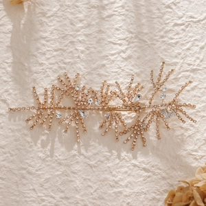 Luxurious bridal hair clip with gold coral design and sparkling rhinestone crystals