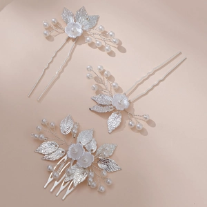 Three-piece bridal silver hair pin and comb set with metallic leaves and white flowers