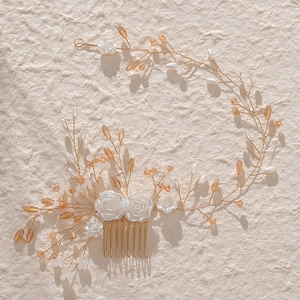 Elegant bridal hair comb with white resin flowers, pearls and golden crystals