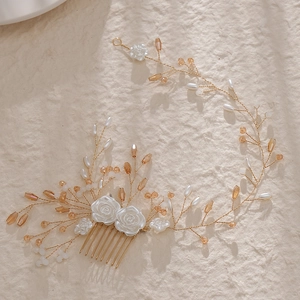 Elegant bridal hair comb with white resin flowers, pearls and golden wire vine details