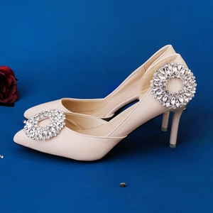 Elegant pointed toe stiletto heels in beige with sparkling geometric rhinestone buckles