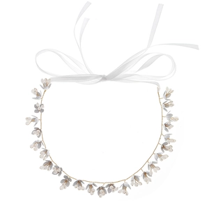 Elegant white floral bridal headband with crystals and ribbons for wedding hairstyles
