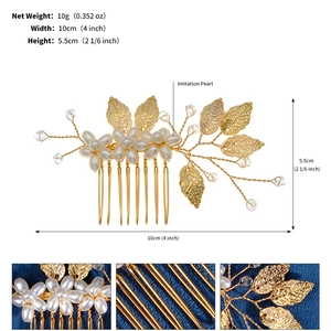 Detail of handmade gold bridal hair comb with pearls and metal leaves for weddings