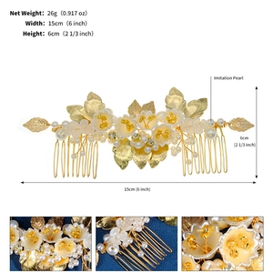 Detail view of a handmade gold pearl bridal hair comb with vintage floral leaf designs