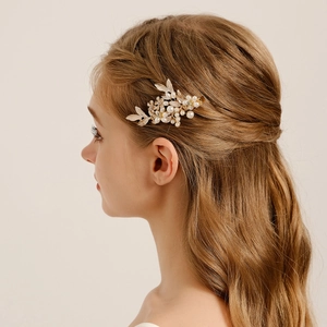 Elegant bridal leaf hair clip with pearls and gold floral metal accents for styling