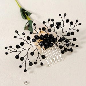 Detailed macro shot of handmade black crystal bead hair comb for bridal wedding parties