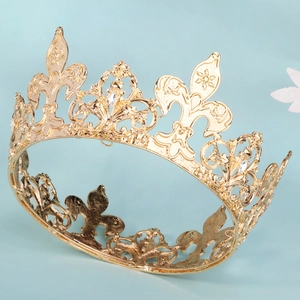 Macro shot of gold alloy crown featuring intricate European patterns and sparkling rhinestones