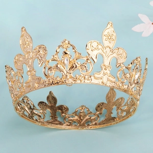 Golden luxury crown with fleur-de-lis motifs and rhinestones for bridal wedding attire