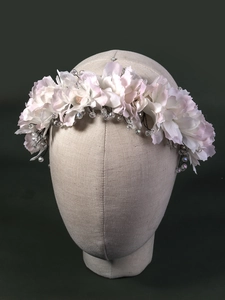 Detail of handmade fabric flower headband with satin petals and crystal beads