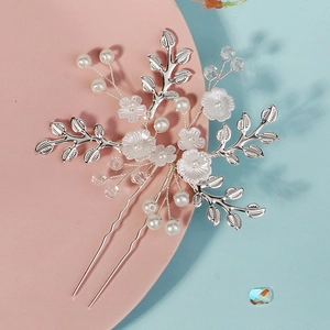 Handmade bridal hair pin with white flowers and pearls on a silver metal U-shaped fork