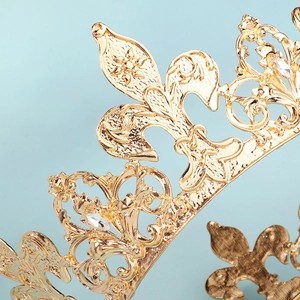 Luxurious gold alloy crown with intricate fleur-de-lis engravings and sparkling rhinestones