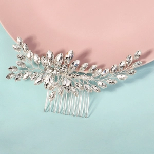 Elegant marquise rhinestone wedding hair comb with silver leaf patterns on pink-blue background