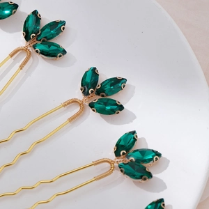 U-shaped bridal hair pin with emerald green crystals and elegant gold-plated finish