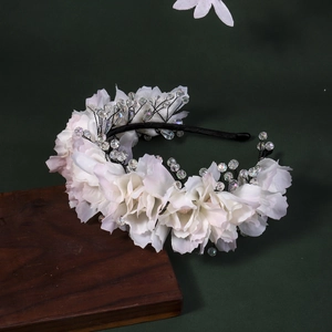Exquisite handmade floral headband with white silk flowers and crystal beads for weddings