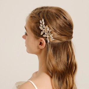 Elegant bridal hair clip with gold wire, crystals and pearls for wedding hairstyles