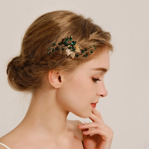 Peigne à cheveux élégant doré avec feuilles et strass verts pour coiffures de mariée