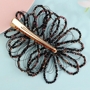 Handmade black beaded flower hair clip with elegant dark crystals and gold duckbill clip