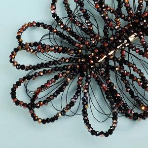 Handmade beaded flower hair clip with black crystal beads and AB rainbow coating effect