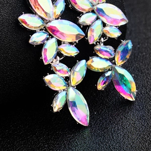 Macro shot of colorful marquise-cut AB crystals on long bridal butterfly drop earrings