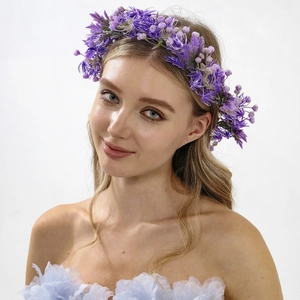 Close-up of artificial purple floral wreath headband with detailed silk petals for brides