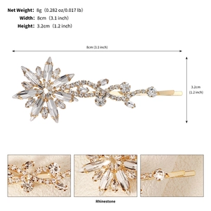 Detail of star-shaped rhinestone hair clip with dimensions 8cm by 3.2cm in gold finish