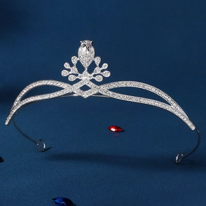 Detailed macro view of silver bridal tiara featuring drop-shaped zircon and floral rhinestones