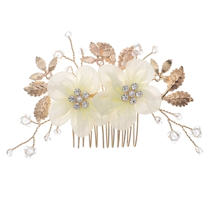 Elegant bridal hair comb with ivory fabric flowers, crystals, and pearls on gold branch