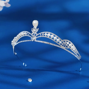 Silver bridal tiara with sparkling rhinestones and white pearls for wedding parties