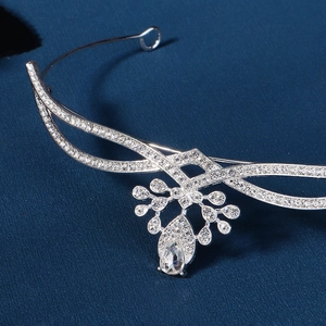 Elegant silver bridal tiara with AAA zircon water drop centerpiece on blue fabric
