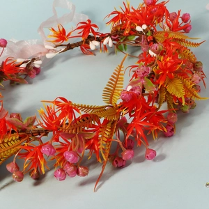 Bohemian floral crown for brides with orange-red flowers and light pink chiffon ribbon