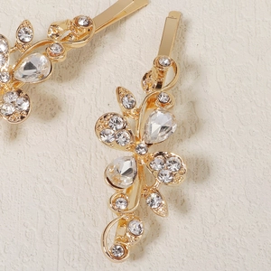 Detailed macro view of golden flower hair clip with sparkling crystal rhinestones