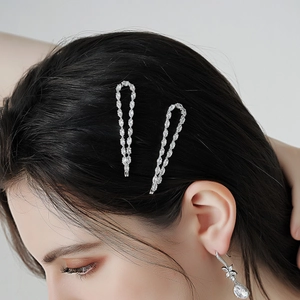 Elegant silver hair clips and drop earrings set with marquise cut sparkling crystals