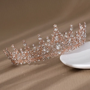 Detail shot of rose gold bridal tiara with intricate pave-set crystals and hollow design