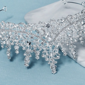 Luxurious silver bridal crown with intricate crystal rhinestones for wedding banquet decor