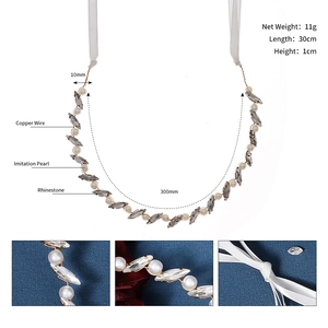 Detailed view of handmade pearl bridal headband with marquise rhinestones and white ribbon