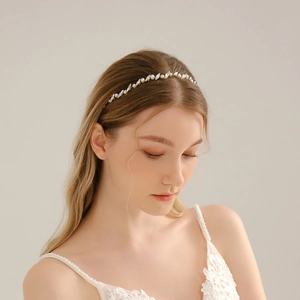 Detailed close-up of handmade bridal headband with pearls and marquise rhinestones