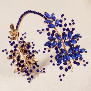 Handcrafted blue crystal and gold wire flower headband with secure side combs for brides