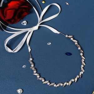 Detail showing bridal headband with pearls, marquise crystals and golden wire