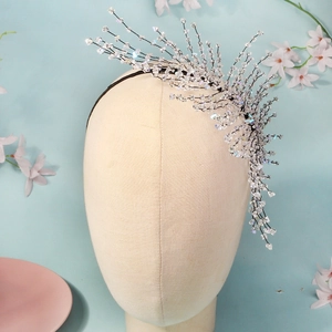 Macro detail of handmade crystal beaded headband featuring elegant radiating fringe design