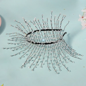 Detail of handmade sunburst beaded headband with clear crystals on black wire branches