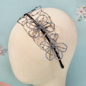 Detail of handcrafted bridal headband featuring blue crystal beads and 3D wire flowers