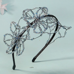 Elegant bridal crystal headband featuring handmade blue beaded flowers for weddings