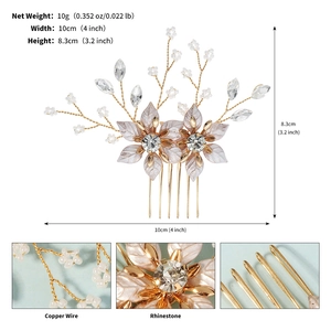 Detailed macro view of handmade gold floral bridal hair comb with beads and rhinestones