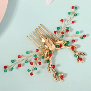 Détail du peigne de Noël doré avec tête de renne et perles de cristal rouges et vertes