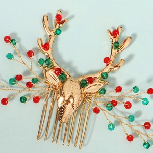 Détail du peigne à cheveux renne de Noël avec perles rouges et vertes sur base dorée