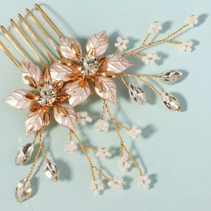 Golden bridal hair comb with pink enamel floral leaves and beaded branch details