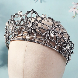 Close-up of black alloy Gothic queen crown with sparkling rhinestones and teardrop jewels