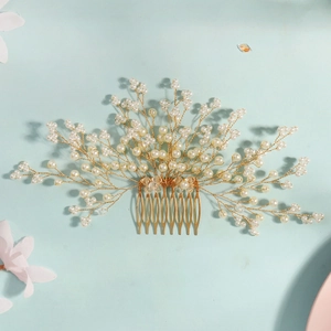 Elegant gold bridal hair comb with white pearls and crystal beads for wedding styling