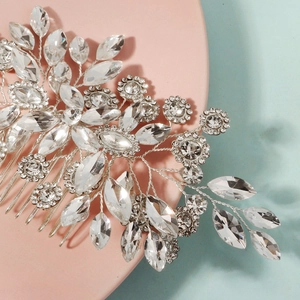 Silver bridal hair comb with crystal sunflower and leaf details for wedding hairstyles