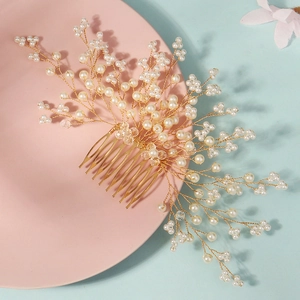 Handmade bridal hair comb with elegant white pearls and crystals on a gold branch base